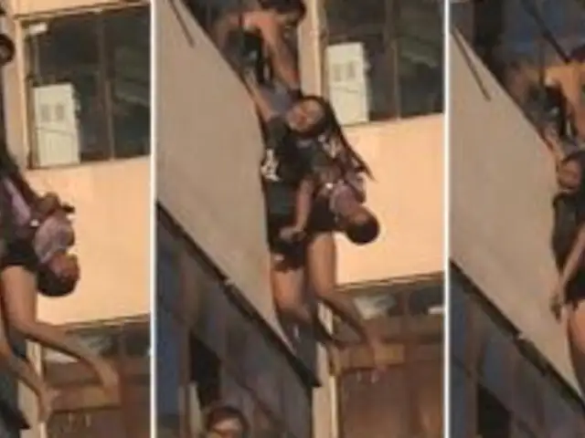 VIDEO: Hombre salva a suicida apunto de caer desde un quinto piso en China