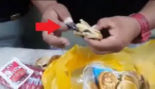 Mujer trató de ingresar al penal El Milagro con chips y celular camuflados en panes