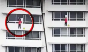 San Isidro: hombre limpia ventanas de piso 13 sin medidas de seguridad