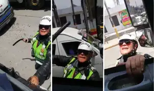 Mujer policía se trepa a la cabina de un camión para increpar a conductor