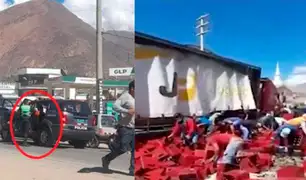 Huánuco: policía se lleva caja de cerveza de camión que se volcó en carretera